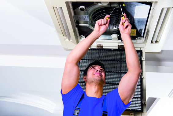 A gentleman fixing air conditioning